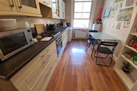 A bright and well-maintained kitchen featuring ...