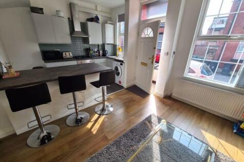 Bright and modern kitchen featuring a spacious ...