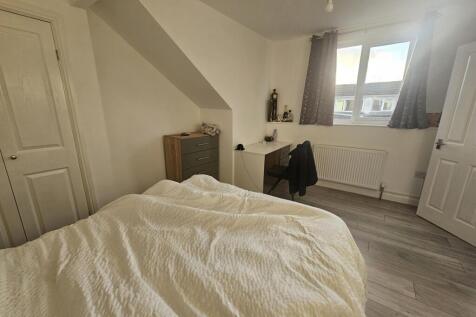 Bright and inviting master bedroom featuring a ...