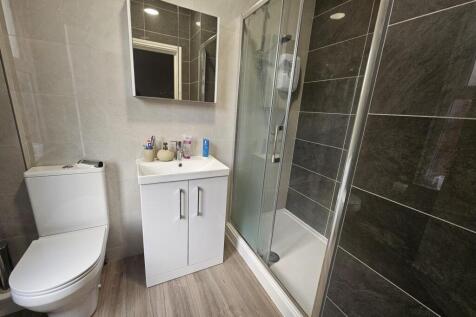 Bright and modern bathroom featuring a spacious...
