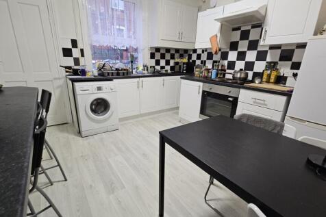 Bright and functional kitchen with ample worksp...