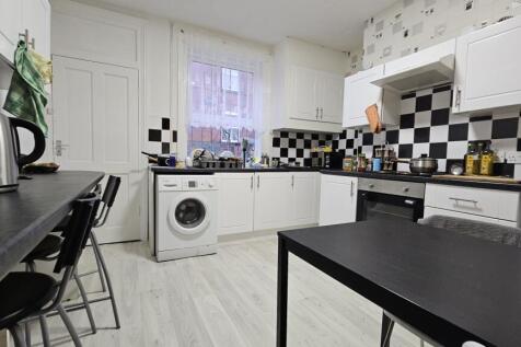 Modern and bright kitchen with ample work surfa...