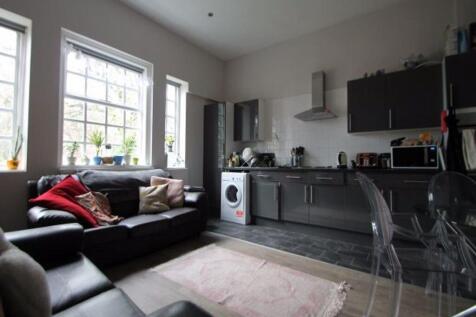 A bright and inviting modern living room featur...