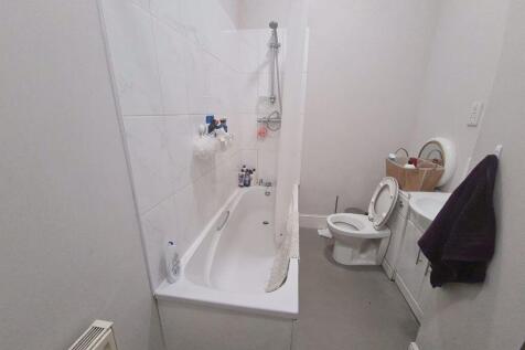 A clean and well-maintained bathroom featuring ...