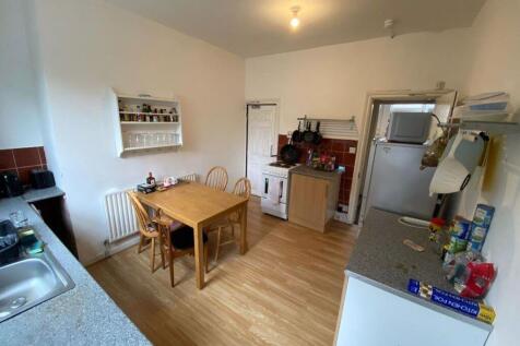 A bright and functional kitchen area with moder...
