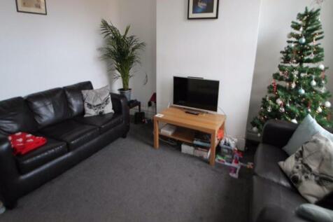 A cozy and well-maintained living room featurin...