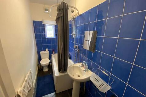 A clean and well-maintained bathroom with a lar...
