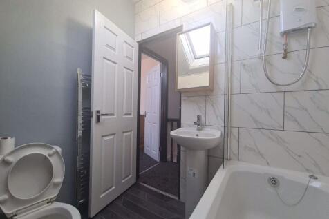 A clean and well-maintained bathroom featuring ...