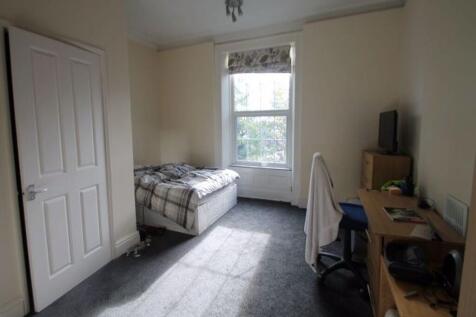 Bright and tidy room with a large window allowi...