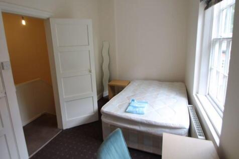 Cozy single bedroom featuring a comfortable sin...