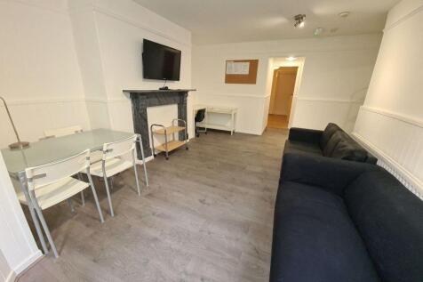 A spacious and well-maintained living room feat...