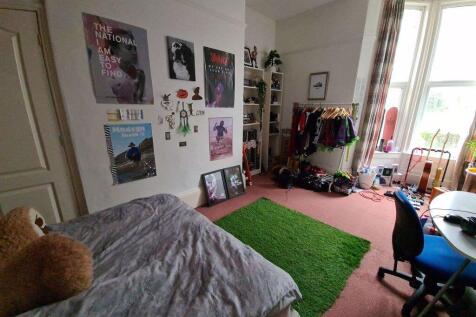 A bright and welcoming living room featuring a ...