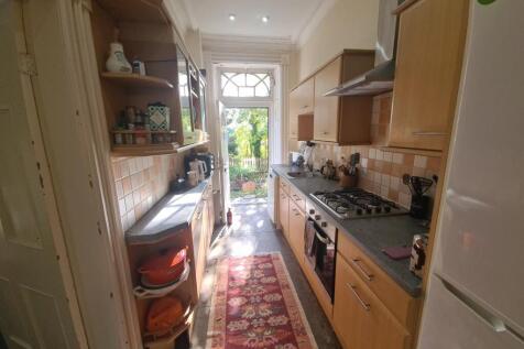 A well-maintained kitchen with natural light st...