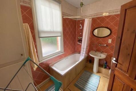 A clean and well-maintained bathroom featuring ...