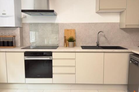 Modern, well-maintained kitchen featuring a sle...