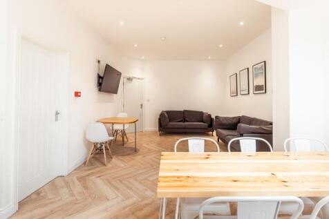 Bright, well-maintained living room with modern...