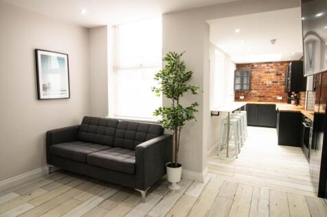 Bright and welcoming living room featuring a co...