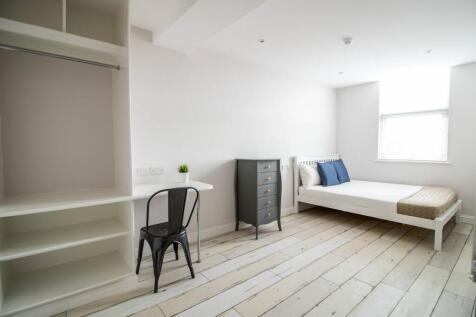Bright and airy single bedroom featuring a neat...
