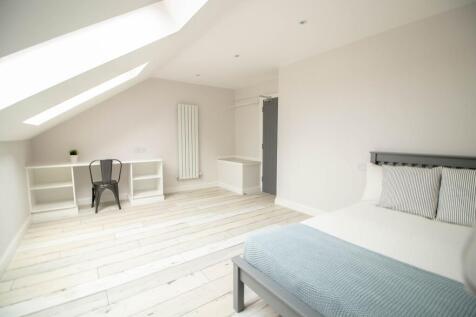 Bright and airy bedroom with a minimalist desig...