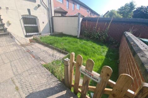 Bright and inviting garden space featuring a we...