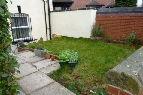 Well-maintained garden area with lush green gra...