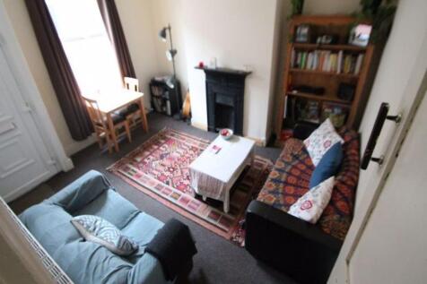 A cozy and inviting living room featuring comfo...