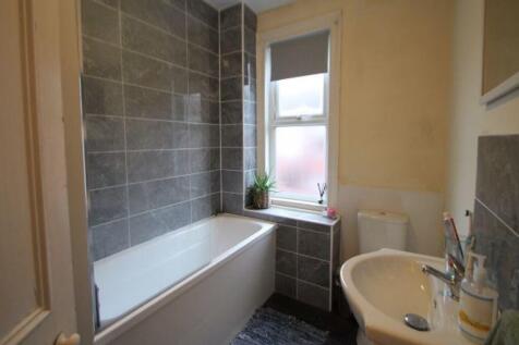 A bright and well-maintained bathroom featuring...