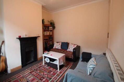 Cozy living room featuring comfortable seating,...