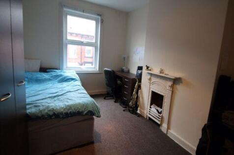 A cozy single bedroom featuring a comfortable s...