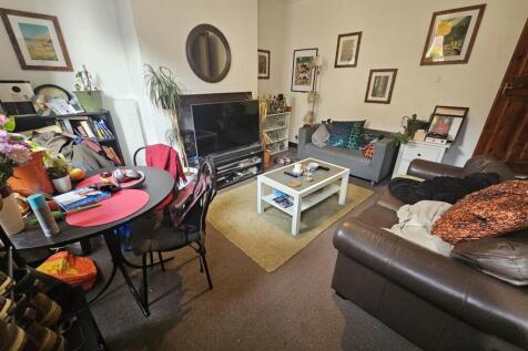 Cozy living room featuring comfortable sofas, a...