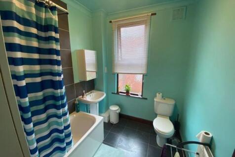 A neat and well-maintained bathroom featuring a...