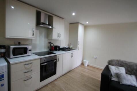 A modern, well-lit living space with ample room...