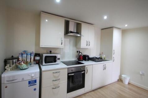 A well-maintained modern kitchen with ample nat...