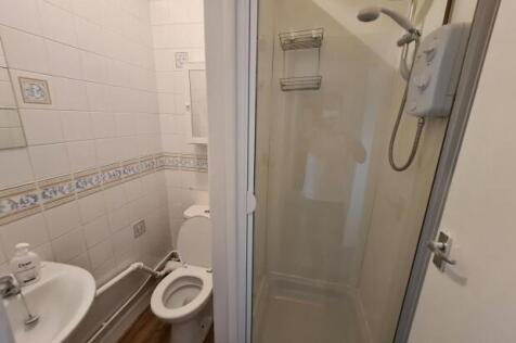 A clean and well-maintained bathroom featuring ...