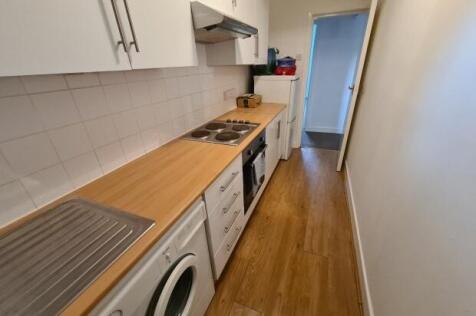 A well-maintained kitchen featuring a wooden wo...