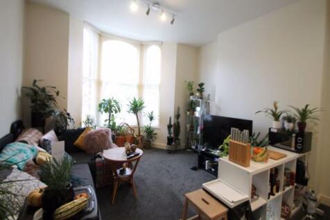 A cozy and inviting living room filled with nat...