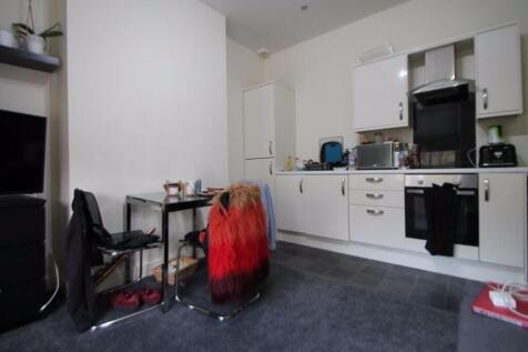 A bright and functional kitchen area featuring ...