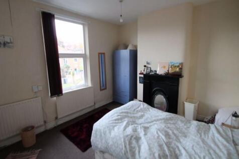 A well-lit, clean double bedroom with a comfort...