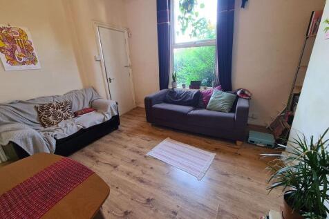 Bright and welcoming living room featuring comf...