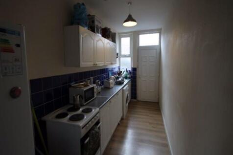 A compact kitchen with a neat arrangement of ap...