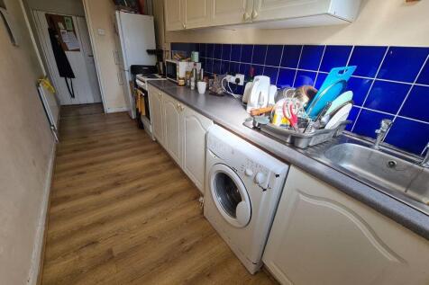 A clean and well-organized kitchen with a moder...