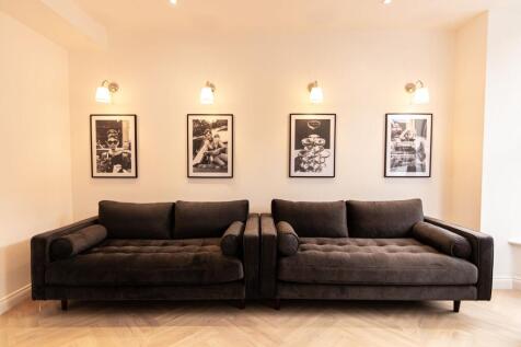 A stylish, contemporary living room featuring t...