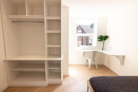 Bright and airy room with a large window allowi...