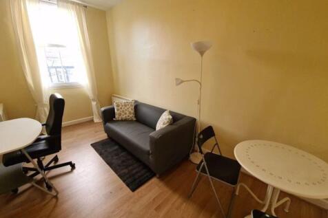 A bright and tidy double bedroom featuring a co...