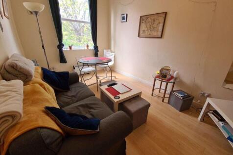 Cozy living room with a comfortable sofa, natur...