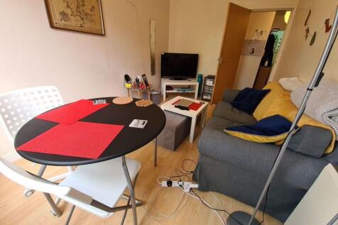 Cozy living space featuring a comfortable sofa ...