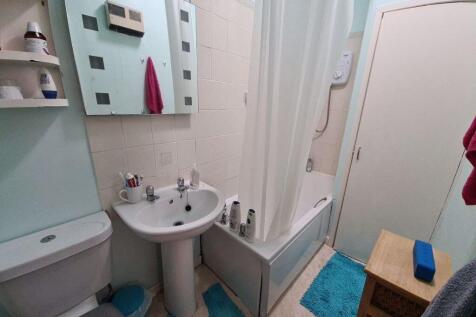 A clean and well-maintained bathroom featuring ...