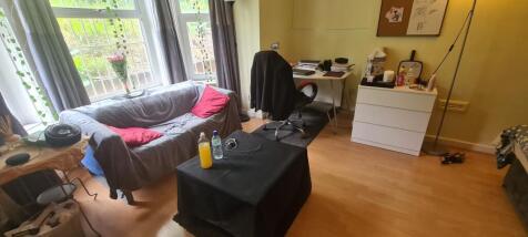 A cozy living room with natural light streaming...