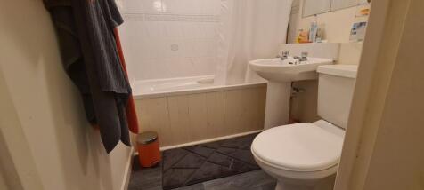 A clean and well-maintained bathroom featuring ...