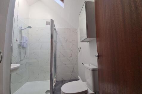 Bright and modern bathroom featuring a spacious...